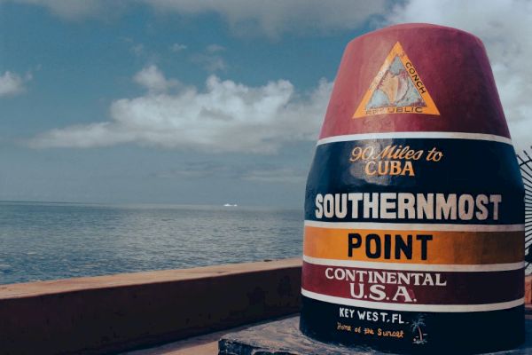 A colorful buoy marks the southernmost point in the continental U.S.A. in Key West, FL, noting 